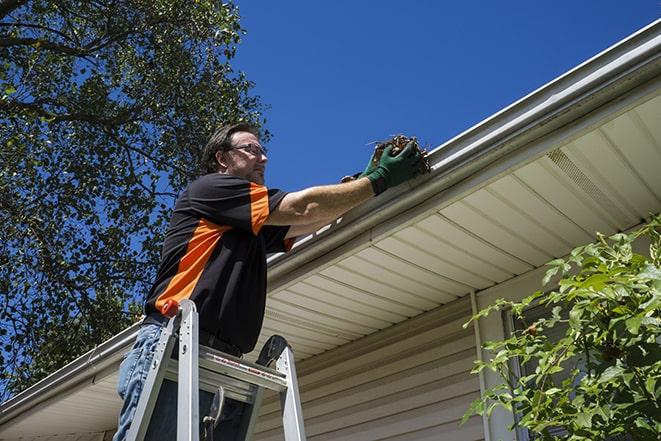 technician replacing a rusted gutter in Blackfoot ID